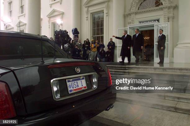 Outgoing U.S. President Bill Clinton waves to the media as he leaves the White House with U.S. President-elect George W. Bush January 20, 2001 in...