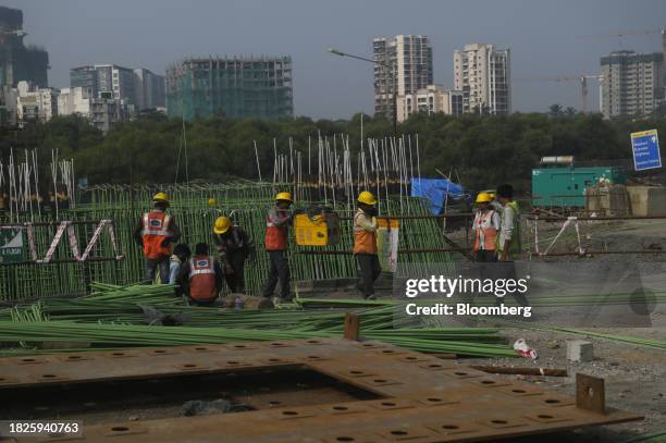 Workers at a construction site in Mumbai, India, on Wednesday, Dec. 6, 2023. India's stock market value reached more than $4 trillion Tuesday for the...