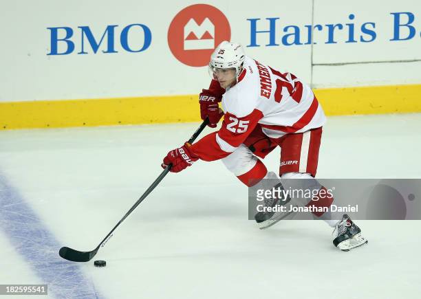 Cory Emmerton of the Detroit Red Wings controls the puck against the Chicago Blackhawks during an exhibition game at United Center on September 17,...