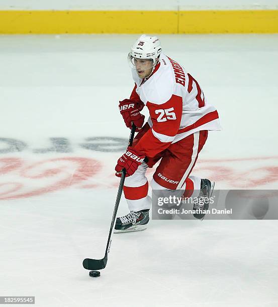 Cory Emmerton of the Detroit Red Wings controls the puck against the Chicago Blackhawks during an exhibition game at United Center on September 17,...