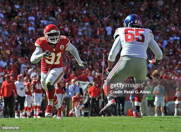 Linebacker Tamba Hali of the Kansas City Chiefs rushes against offensive tackle Will Beatty of the New York Giants during the second half on...