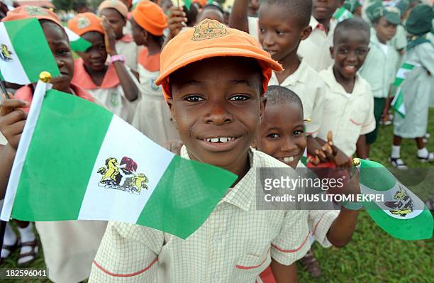 Nigerian children attend independence day celebrations in Lagos in October 1, 2013. Nigeria's president Goodluck Jonathan said he had formed a panel...