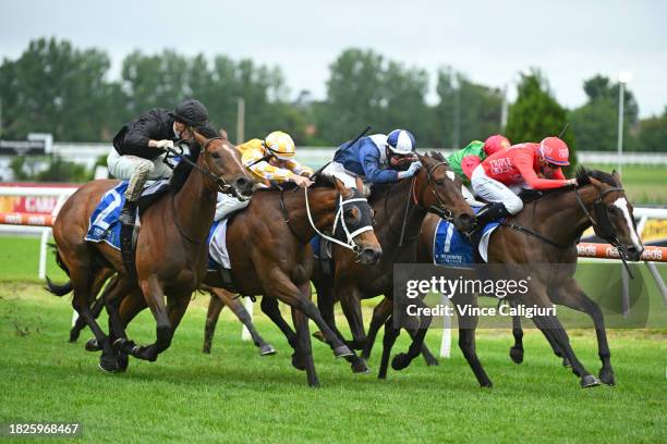 Michael Dee riding Revolutionary Miss defeats Thalassophile, Zennzella and Lady Jones in Race 9, the Tile Importer Summoned Stakes, during Melbourne...