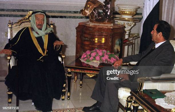 Iraqi President Saddam Hussein meets with the chief of Qatar's ruling al-Thani family, Sheikh Fahd bin Mohammad al-Thani, in Baghdad 26 November...