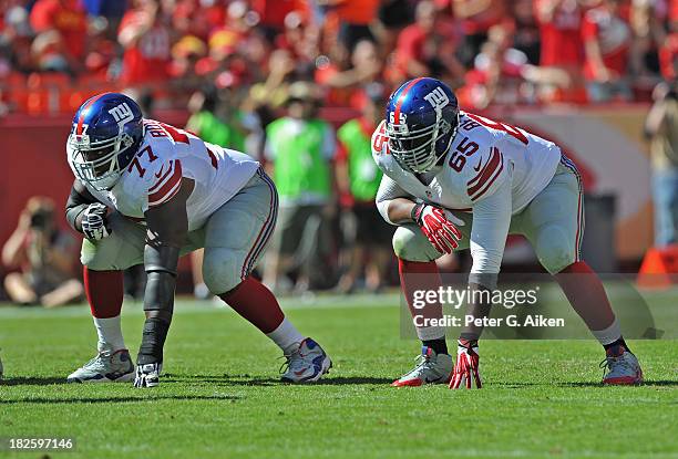 Offensive linemen Kevin Boothe and Will Beatty of the New York Giants gets set on the line against the Kansas City Chiefs during the first half on...