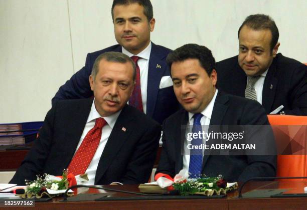 Turkey's Prime Minister Recep Tayyip Erdogan and deputy Prime Minister Ali Babacan attend a debate as the Parliament reconvenes after a summer recess...