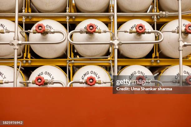 natural gas : cng (compressed natural gas) cylinders. - cylinder stock pictures, royalty-free photos & images