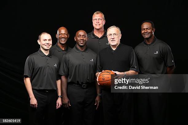 David Adelman, Terry Porter, Bobby Jackson, Jack Sikma, Head Coach Rick Adelman, and T.R. Dunn of the Minnesota Timberwolves poses for a portrait...