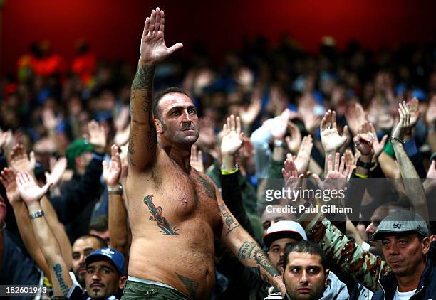 Napoli fans cheer on their team during UEFA Champions League Group F match between Arsenal FC and SSC Napoli at Emirates Stadium on October 1, 2013...