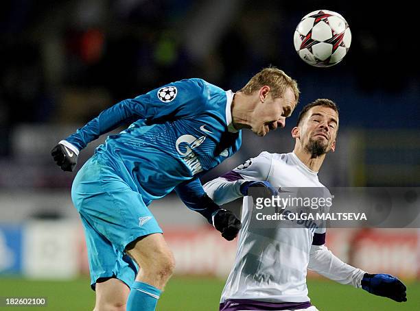 Zenit Saint-Petersburg's Aleksandr Anyukov vies with Austria Wien's Tomas Simkovic during their UEFA Champions League group G match in...