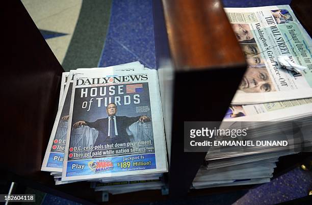 Copy of the New York Daily News, featuring Speaker of the US House of Representatives John Boehner, is on display following an US government shutdown...