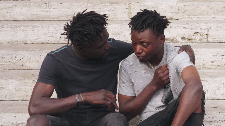 https://media.gettyimages.com/id/1826051762/video/depressed-young-black-man-in-a-moment-of-despair-being-comforted-by-his-friend.jpg?b=1&s=640x640&k=20&c=9U9-6rJ-eKQBKNB22yqmE_2HDg0bpJfEyhPIu_eUB0I=