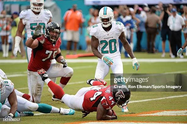 Running back Jason Snelling of the Atlanta Falcons scores a touchdown during a NFL game against the Miami Dolphins at Sun Life Stadium on September...