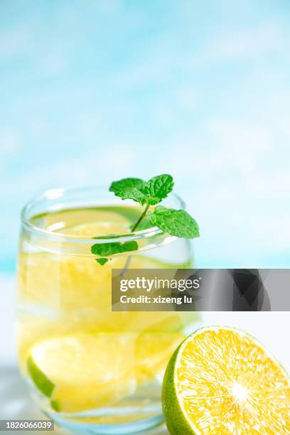 a glass of water with oranges and mint - 無人 stock pictures, royalty-free photos & images