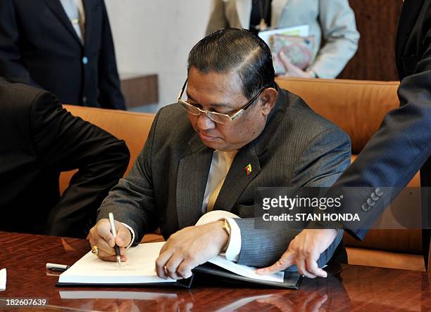 Wunna Maung Lwin, Foreign Minister of Myanmar, signs a guest book before his meeting with United Nations Secretary General Ban Ki-Moon during the...