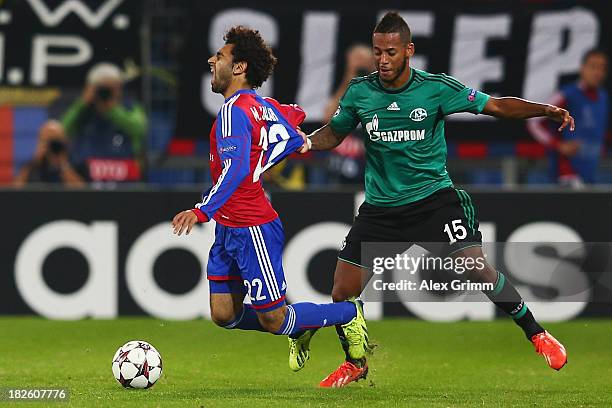 Mohamed Salah of Basel is challenged by Dennis Aogo of Schalke during the UEFA Champions League Group E match between FC Basel 1893 and FC Schalke 04...