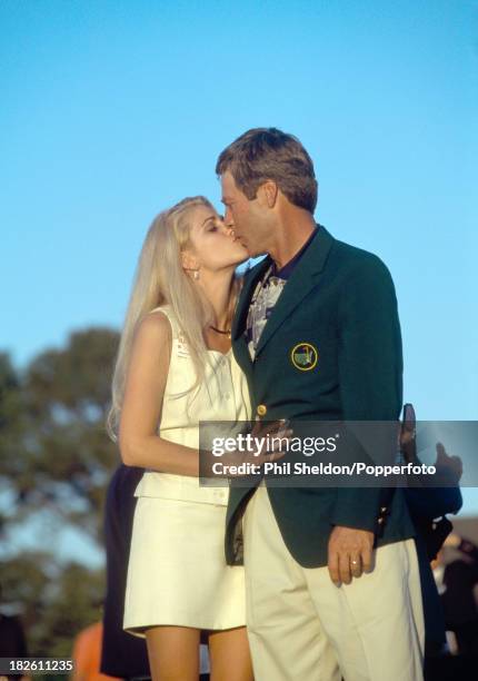 Ben Crenshaw of the United States kisses his wife Julie after winning the US Masters Golf Tournament held at the Augusta National Golf Club, Georgia,...