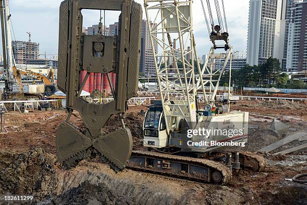 Heavy equipment is operated at the construction site of Tecnisa SA's Jardim das Perdizes housing development in Sao Paulo, Brazil, on Friday, Sept....