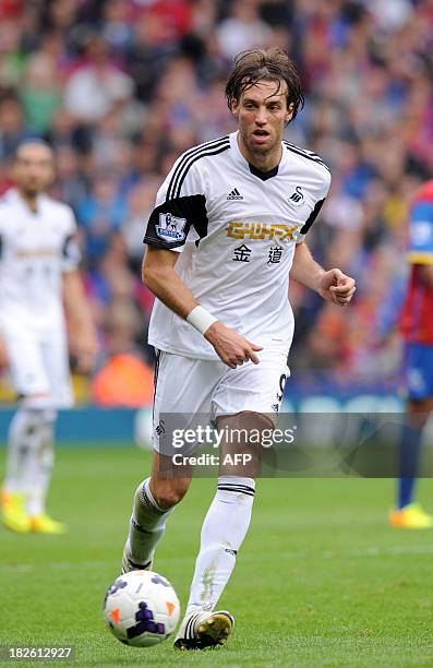 Swansea City's Spanish striker Miguel Michu controls the ball during the English Premier League football match between Crystal Palace and Swansea...