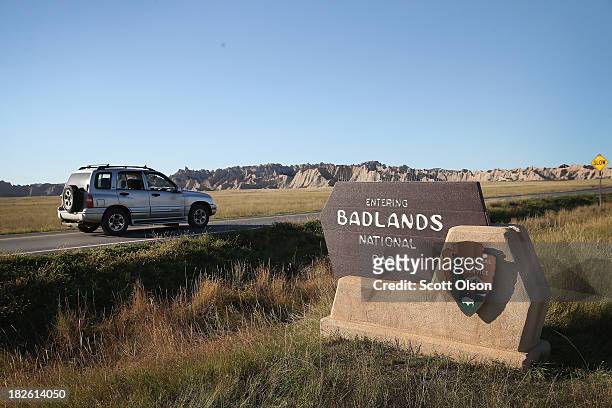 Visitors drive into the Badlands National Park on October 1, 2013 near Wall, South Dakota. Although small sections of the Badlands were accessible,...