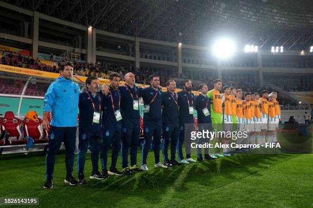 Head Coach Diego Placente and Argentina staff and bench players listen to their national anthem prior to the FIFA U-17 World Cup 3rd Place Final...