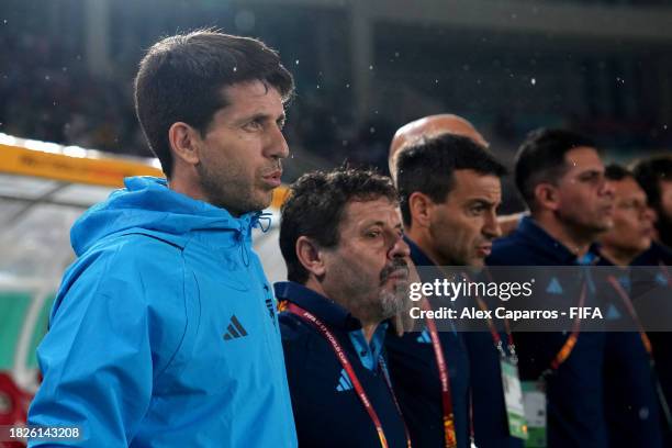 Head Coach Diego Placente and Argentina staff and bench players listen to their national anthem prior to the FIFA U-17 World Cup 3rd Place Final...