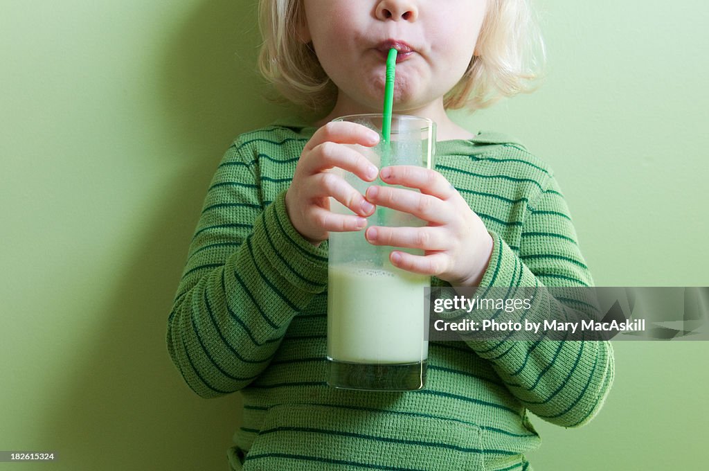 Girl in Green Sipping Green Milkshake