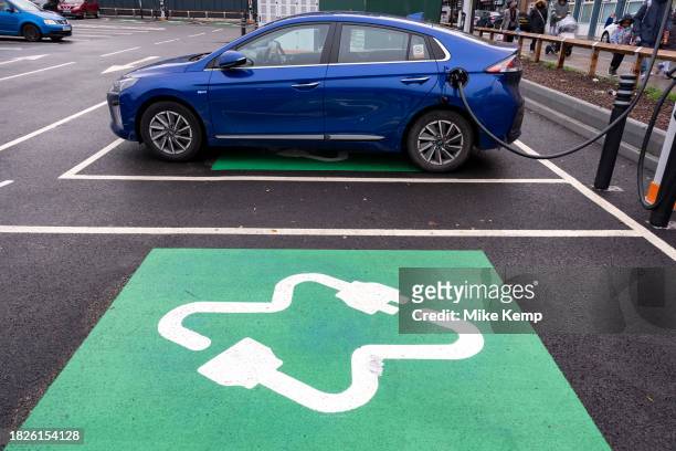 Ultra rapid electric vehicle charging points in a supermarket carpark in Whitechapel on 5th December 2023 in East London, United Kingdom. An electric...
