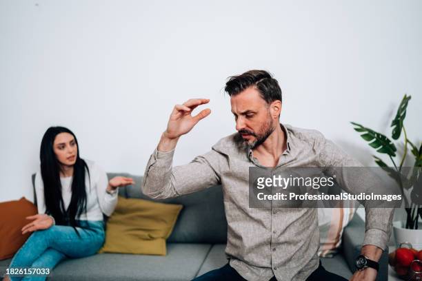 young couple in a heated debate over future plans - mad girlfriend stock pictures, royalty-free photos & images