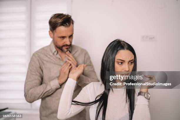 boyfriend shows compassion and apologizes to upset girlfriend - mad girlfriend stock pictures, royalty-free photos & images