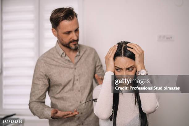 boyfriend takes responsibility and makes amends with girlfriend after argument - mad girlfriend stock pictures, royalty-free photos & images