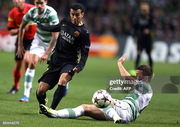 Celtic's Welsh defender Adam Mathews challenges Barcelona's Spanish forward Pedro Rodriguez during their UEFA Champions League Group H football match...