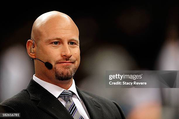 Analyst Trent Dilfer watches pre-game activities prior to a game between the Miami Dolphins and the New Orleans Saints at the Mercedes-Benz Superdome...