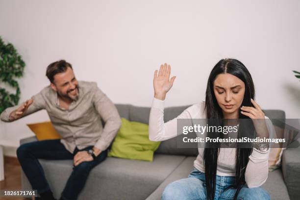 disagreement between mid adult man and young woman leads to silence - mad girlfriend stock pictures, royalty-free photos & images