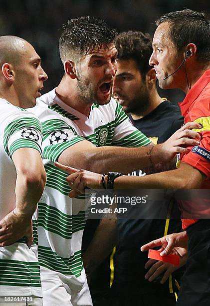 Celtic's Scottish defender Charlie Mulgrew shouts at the referee after Scottish midfielder Scott Brown was red-carded during the UEFA Champions...