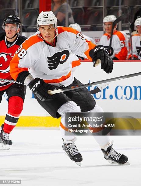 Oliver Lauridsen of the Philadelphia Flyers skates against the New Jersey Devils during the preseason game at Prudential Center on September 26, 2013...