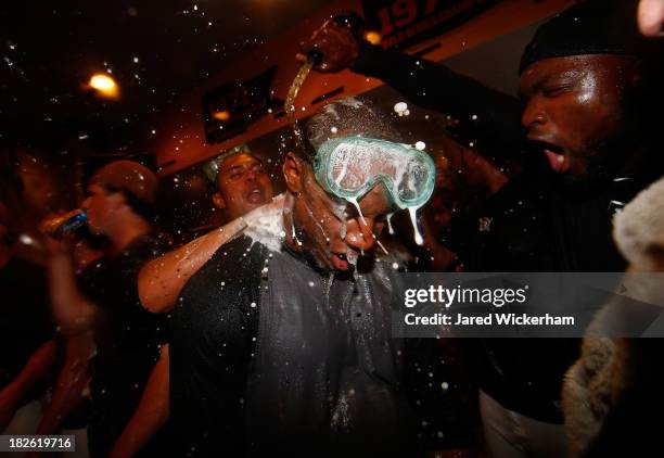 Starling Marte and Felix Pie of the Pittsburgh Pirates celebrate in the clubhouse following their 6-2 win against the Cincinnati Reds during the...