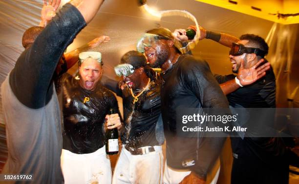 Jose Tabata, Andrew McCutchen, Felix Pie and Pedro Alvarez of the Pittsburgh Pirates celebrate after defeating the Cincinnati Reds 6-2 in the...