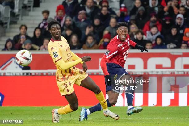 Jonathan DAVID of Lille and Joseph NDUQUIDI of Metz during the Ligue 1 Uber Eats match between Lille Olympique Sporting Club and Football Club de...