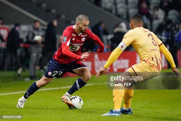 Edon ZHEGROVA of Lille and Matthieu UDOL of Metz during the Ligue 1 Uber Eats match between Lille Olympique Sporting Club and Football Club de Metz...