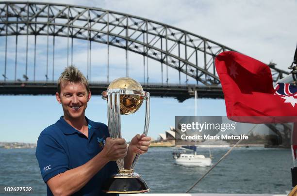 Brett Lee poses on Sydney Harbour with the ICC Cricket World Cup trophy during celebrations to mark 500 days to go until the 2015 ICC Cricket World...