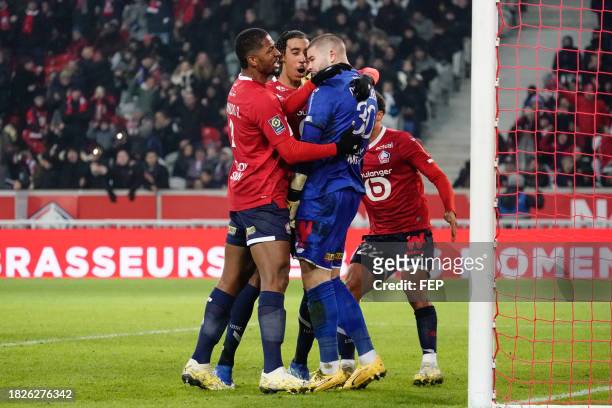 Lucas CHEVALIER, ALEXSANDRO and Leny YORO of Lille during the Ligue 1 Uber Eats match between Lille Olympique Sporting Club and Football Club de Metz...