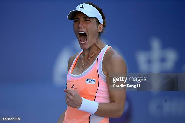 Andrea Petkovic of Germany celebrates during her women's singles match against Svetlana Kuznetsova of Russia on day five of the 2013 China Open at...