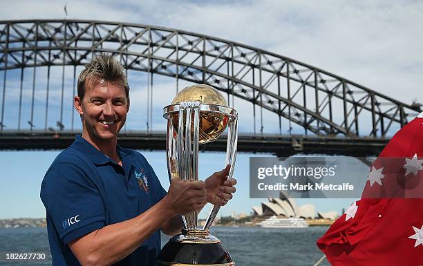 Brett Lee poses on Sydney Harbour with the ICC Cricket World Cup trophy during celebrations to mark 500 days to go until the 2015 ICC Cricket World...