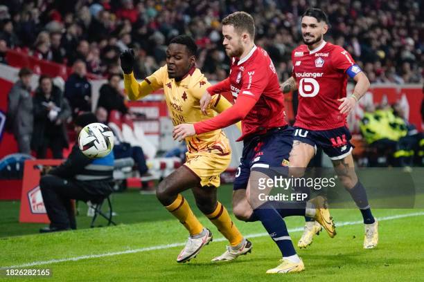Gabriel MUDMUNDSSON, Remy CABELLA of Lille and Joel ASORO of Metz during the Ligue 1 Uber Eats match between Lille Olympique Sporting Club and...