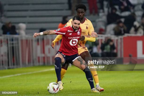 Remy CABELLA of Lille and Joseph NDUQUIDI of Metz during the Ligue 1 Uber Eats match between Lille Olympique Sporting Club and Football Club de Metz...
