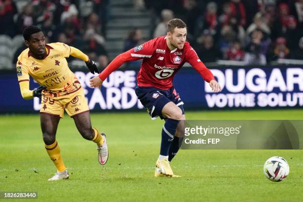 Gabriel MUDMUNDSSON of Lille and Joel ASORO of Metz during the Ligue 1 Uber Eats match between Lille Olympique Sporting Club and Football Club de...