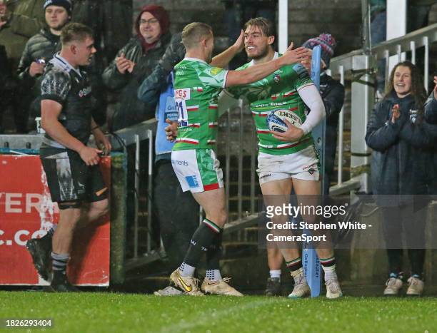 Leicester Tigers' Oliver Hassell-Collins celebrates scoring his side's sixth try with team-mate Tom Whiteley during the Gallagher Premiership Rugby...