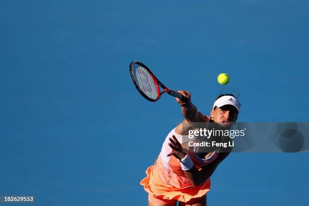 Andrea Petkovic of Germany serves during her women's singles match against Svetlana Kuznetsova of Russia on day five of the 2013 China Open at the...