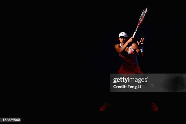 Andrea Petkovic of Germany returns a shot during her women's singles match against Svetlana Kuznetsova of Russia on day five of the 2013 China Open...